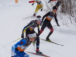 three skiers lead w