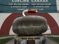 curling-stone-front-fort-william-gardens-hdr-curling-stone-and-pedestal